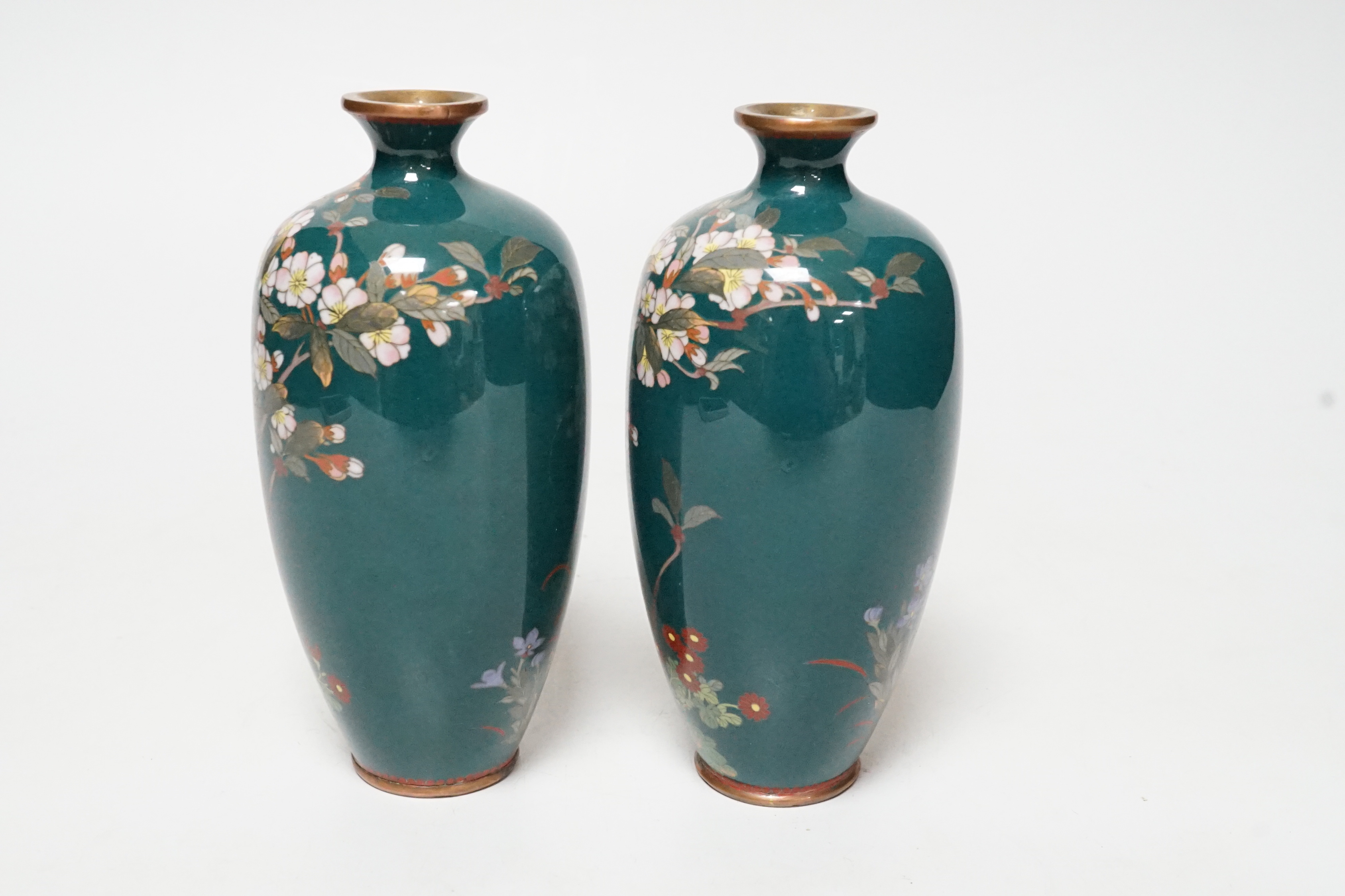 A small pair of Japanese silver wire cloisonné enamel green ground vases, early 20th century, 14cm